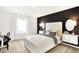 Stylish bedroom featuring modern decor, accent wall, and ample natural light at 5312 Summerton St, McCordsville, IN 46055