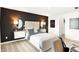 Stylish bedroom featuring modern decor, accent wall, and ample natural light at 5312 Summerton St, McCordsville, IN 46055