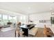 Open concept kitchen and dining area with white cabinetry, ample seating, and natural light at 5312 Summerton St, McCordsville, IN 46055