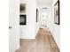 Bright hallway with neutral carpet and white walls decorated with framed artwork at 5312 Summerton St, McCordsville, IN 46055