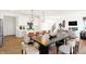 Beautiful kitchen featuring white cabinetry, modern lighting, and an expansive island with bar seating at 5312 Summerton St, McCordsville, IN 46055