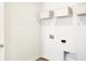Clean laundry room featuring white wire shelving and white storage boxes at 5312 Summerton St, McCordsville, IN 46055