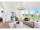 Bright living room with sliding glass doors leading to outdoor space and picturesque backyard views at 5312 Summerton St, McCordsville, IN 46055