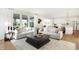 Spacious living room with abundant natural light, two sofas, and an open layout for easy entertaining at 5312 Summerton St, McCordsville, IN 46055