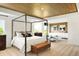 Spacious main bedroom with a decorative wood ceiling and a luxurious king-size bed at 5312 Summerton St, McCordsville, IN 46055