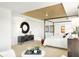 Spacious main bedroom with decorative wood ceiling, with a round mirror and wall art at 5312 Summerton St, McCordsville, IN 46055