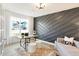 Contemporary study featuring a unique accent wall, stylish furniture, and ample natural light at 5312 Summerton St, McCordsville, IN 46055