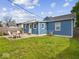 Spacious backyard featuring a patio area perfect for outdoor dining and entertaining guests at 547 W Taylor St, Shelbyville, IN 46176
