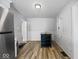 Bright dining area featuring wood floors, white brick wall accent, and a dark table at 547 W Taylor St, Shelbyville, IN 46176