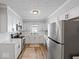 Modern kitchen featuring white cabinets, stainless steel appliances, and elegant countertops at 547 W Taylor St, Shelbyville, IN 46176