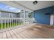 Inviting front porch with white railings and a cozy seating area to enjoy the outdoors at 547 W Taylor St, Shelbyville, IN 46176
