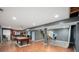 Spacious basement featuring a pool table, bar area, wood-look floors and recessed lighting at 6026 Pennyworth Cir, Indianapolis, IN 46203