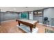 Basement with a billiard table under unique lighting, featuring a cool chalkboard and artistic accents at 6026 Pennyworth Cir, Indianapolis, IN 46203