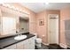 Clean bathroom with a single vanity, a framed mirror, and updated fixtures at 6026 Pennyworth Cir, Indianapolis, IN 46203