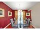 Elegant dining room with modern glass table and sophisticated decor at 6026 Pennyworth Cir, Indianapolis, IN 46203