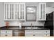 Modern kitchen with sleek countertops, white cabinets, and stainless steel appliances at 6026 Pennyworth Cir, Indianapolis, IN 46203