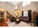 Cozy living room featuring hardwood floors and abundant natural light at 6026 Pennyworth Cir, Indianapolis, IN 46203