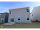 Backyard view featuring the home's siding, windows and a sliding glass door at 6223 Medina Spirit Dr, Indianapolis, IN 46237