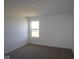Bright bedroom featuring a window, neutral carpet and light walls at 6223 Medina Spirit Dr, Indianapolis, IN 46237