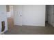 Bedroom features neutral carpet, base trim, and doorways to other rooms at 6223 Medina Spirit Dr, Indianapolis, IN 46237