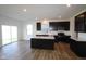 Modern eat-in kitchen features stainless steel appliances, an island, and sliding door access to the yard at 6223 Medina Spirit Dr, Indianapolis, IN 46237