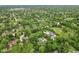 Lush residential area surrounded by green trees, showcasing diverse housing options and neighborhood layout at 6230 E 56Th St, Indianapolis, IN 46226
