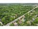 Scenic aerial view highlighting homes near a road, surrounded by lush greenery and established trees at 6230 E 56Th St, Indianapolis, IN 46226