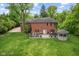 Expansive backyard featuring a large deck with outdoor seating, a grill, a hot tub, and a charming gazebo at 6230 E 56Th St, Indianapolis, IN 46226