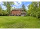 Large backyard featuring mature trees, gazebo, and outdoor deck area at 6230 E 56Th St, Indianapolis, IN 46226