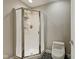 Bathroom featuring a glass shower enclosure and elongated toilet at 6230 E 56Th St, Indianapolis, IN 46226