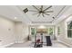 Bedroom featuring a ceiling fan, large windows, and workout equipment at 6230 E 56Th St, Indianapolis, IN 46226