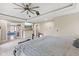 Bedroom featuring a ceiling fan, TV, and bathroom at 6230 E 56Th St, Indianapolis, IN 46226