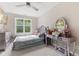 Bedroom featuring a TV, vanity, and large windows at 6230 E 56Th St, Indianapolis, IN 46226