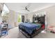 Bedroom featuring a ceiling fan, TV, and desk at 6230 E 56Th St, Indianapolis, IN 46226