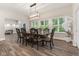 Bright dining room boasts a large window, pendant lighting, and a table with seating for six at 6230 E 56Th St, Indianapolis, IN 46226