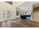 Grand foyer featuring high ceilings, hardwood floors, and modern design elements at 6230 E 56Th St, Indianapolis, IN 46226