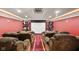 Dedicated home theater with plush seating, projector screen, and themed decor for immersive experience at 6230 E 56Th St, Indianapolis, IN 46226