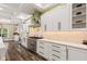 Bright kitchen with white cabinets, stainless steel appliances, marble countertops, and stylish backsplash at 6230 E 56Th St, Indianapolis, IN 46226