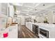 Spacious kitchen featuring marble countertops, stainless steel appliances, and coffered ceilings at 6230 E 56Th St, Indianapolis, IN 46226