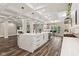 Open concept kitchen and living area featuring a large island, fireplace, and modern decor at 6230 E 56Th St, Indianapolis, IN 46226