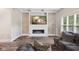 Bright living room features a modern fireplace, stylish decor, and hardwood floors at 6230 E 56Th St, Indianapolis, IN 46226