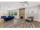 Bright living room with hardwood floors, fireplace, and comfortable seating arrangement at 6230 E 56Th St, Indianapolis, IN 46226