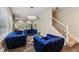 Comfortable living room with three sofas, hardwood flooring, and elegant lighting at 6230 E 56Th St, Indianapolis, IN 46226