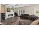 Inviting living room with a modern fireplace, built-in speakers, coffered ceilings, and comfortable seating at 6230 E 56Th St, Indianapolis, IN 46226