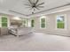 Airy main bedroom with trey ceilings, multiple windows, and plush carpeting at 6230 E 56Th St, Indianapolis, IN 46226