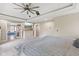 Spacious main bedroom boasts a tray ceiling, ceiling fan, and an ensuite bathroom at 6230 E 56Th St, Indianapolis, IN 46226