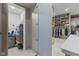 Spacious walk-in closet featuring built-in shelving, ample storage and racks for hanging clothes in a well-lit room at 6230 E 56Th St, Indianapolis, IN 46226