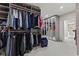 Open closet space featuring ample hanging storage and shelving, with a mirrored wall at the end of the room at 6230 E 56Th St, Indianapolis, IN 46226