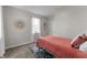 Cozy bedroom featuring carpet, a bed, window, and neutral wall decor, creating a relaxing atmosphere at 650 Overstreet St, Franklin, IN 46131