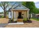 Charming renovated home featuring a cozy porch and well-manicured landscaping at 650 Overstreet St, Franklin, IN 46131